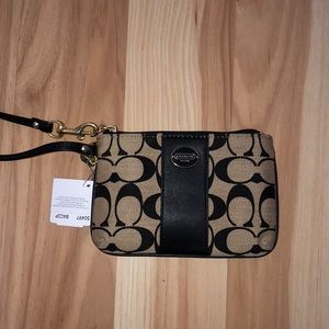 Coach tan and black wristlet